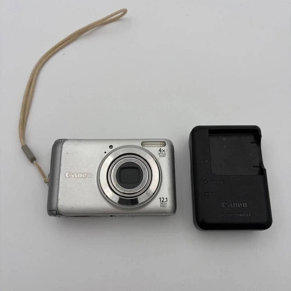 Canon PowerShot A3100 IS Camera Silver w/ Battery Charger Well Loved